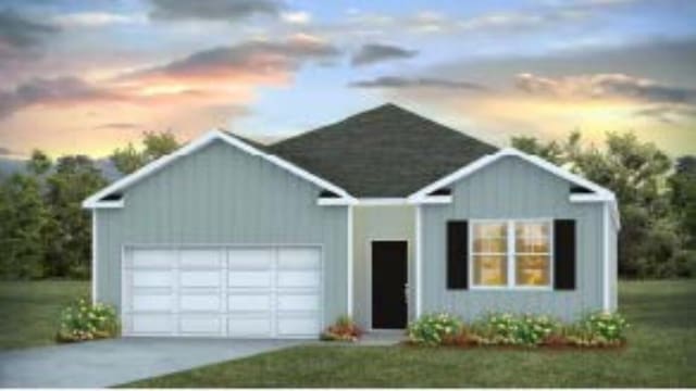 ranch-style house with a garage and driveway