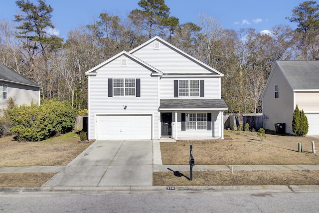 view of front property with a front yard and a garage