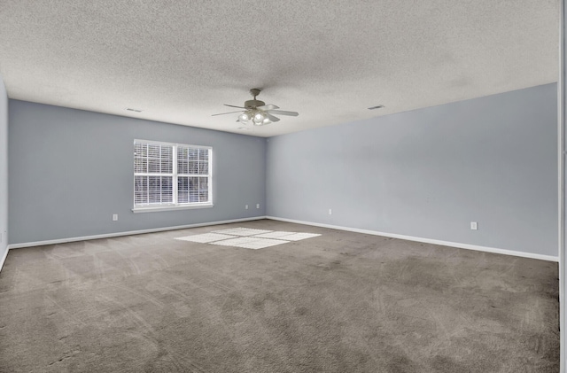 spare room featuring ceiling fan, carpet, and a textured ceiling