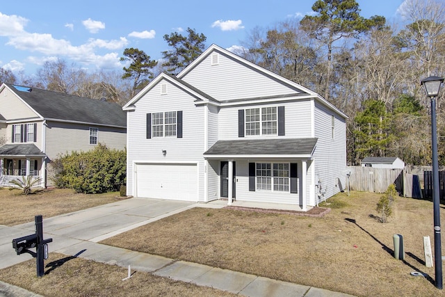 view of front property featuring a garage, a front yard, and a porch