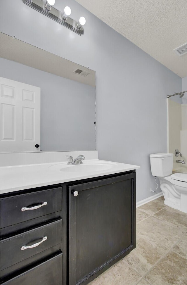 full bathroom with toilet, a textured ceiling,  shower combination, and vanity