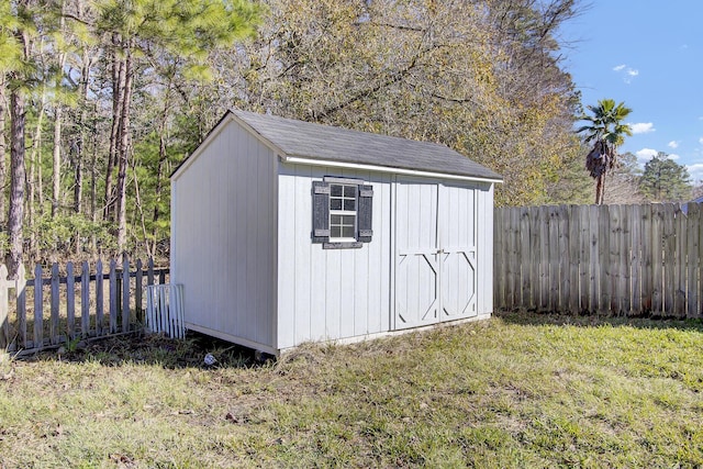 view of outbuilding with a lawn