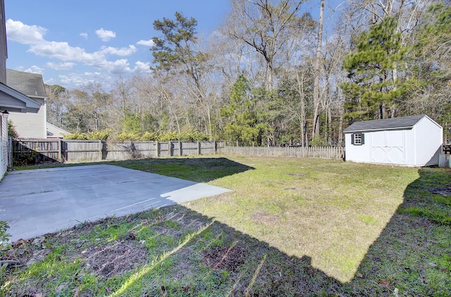 view of yard featuring a patio and a shed