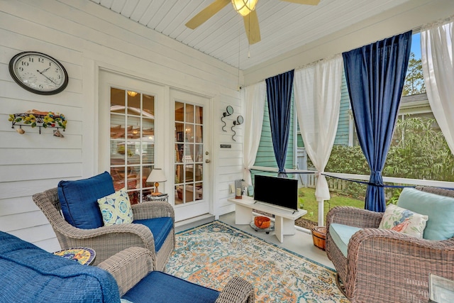 sunroom / solarium with ceiling fan and wood ceiling