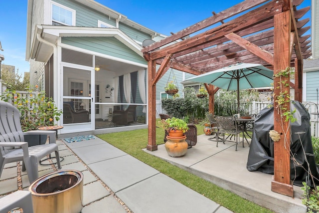 view of patio with a pergola and a sunroom