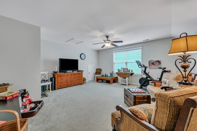 carpeted living room featuring ceiling fan