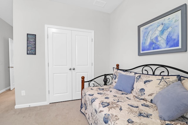 carpeted bedroom featuring a closet