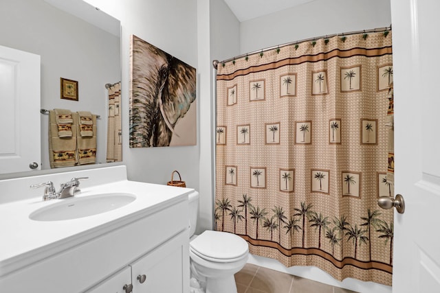 bathroom featuring tile patterned floors, toilet, vanity, and a shower with shower curtain