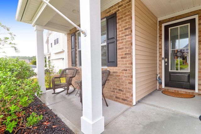 doorway to property featuring a porch