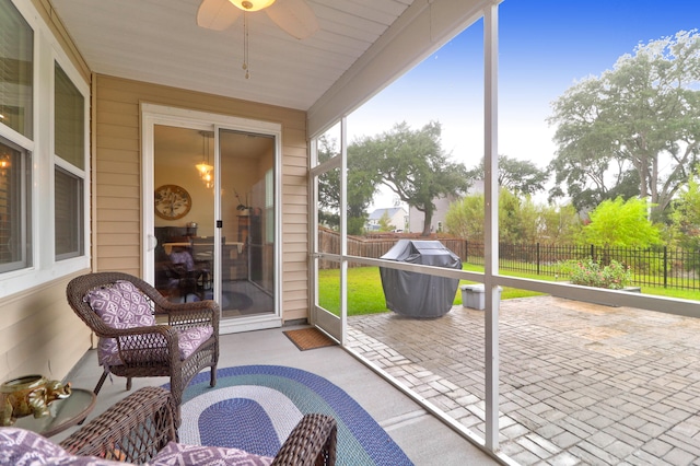 sunroom / solarium with ceiling fan