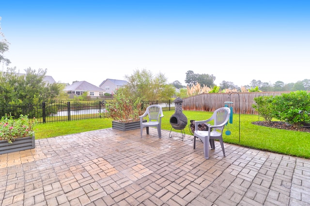 view of patio featuring a water view