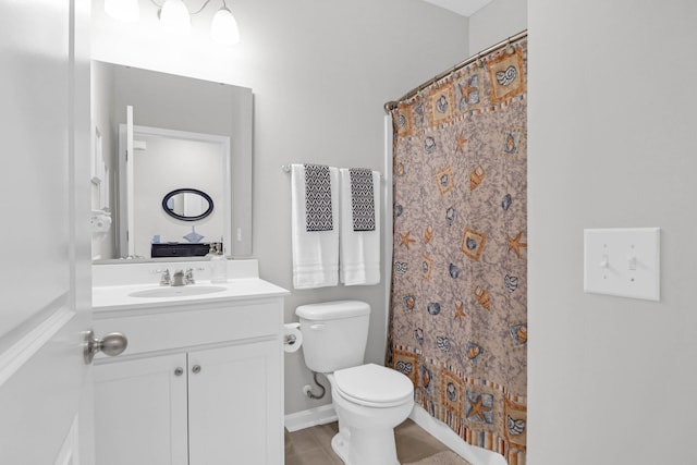 bathroom with vanity, toilet, and a shower with shower curtain