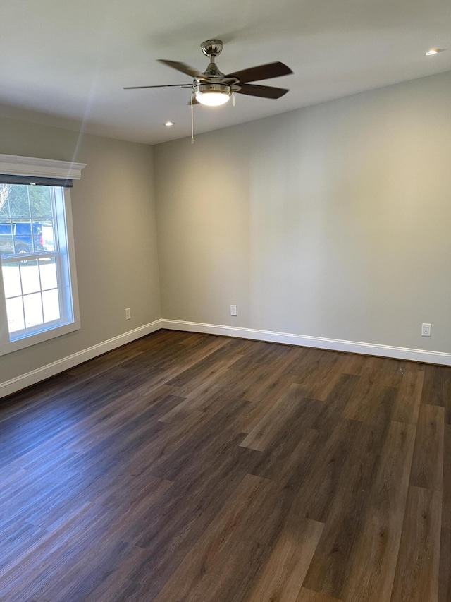 unfurnished room with dark wood-type flooring, recessed lighting, baseboards, and a ceiling fan