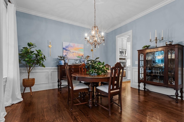 2792 River Vista Way, Mount Pleasant, SC 29466 - dining room with a chandelier, ornamental molding, wood finished floors, a decorative wall, and a wainscoted wall