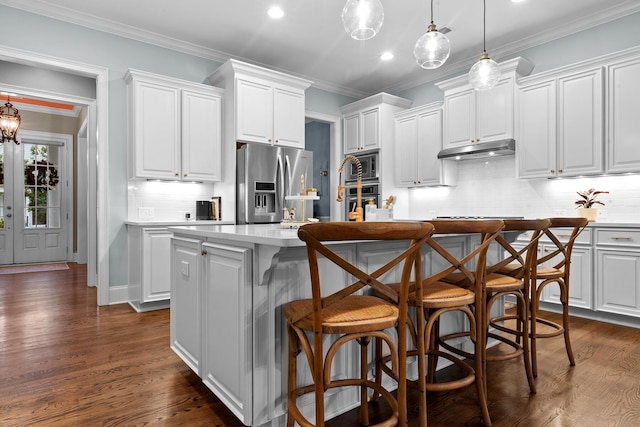 2792 River Vista Way, Mount Pleasant, SC 29466 - kitchen featuring appliances with stainless steel finishes, under cabinet range hood, light countertops, tasteful backsplash, and recessed lighting