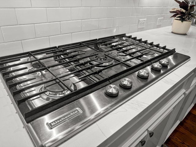 2792 River Vista Way, Mount Pleasant, SC 29466 - kitchen view of tasteful backsplash, stainless steel gas cooktop, and light stone countertops