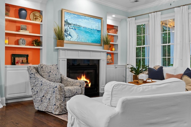 2792 River Vista Way, Mount Pleasant, SC 29466 - sitting room with a glass covered fireplace, built in shelves, crown molding, and dark wood-style floors