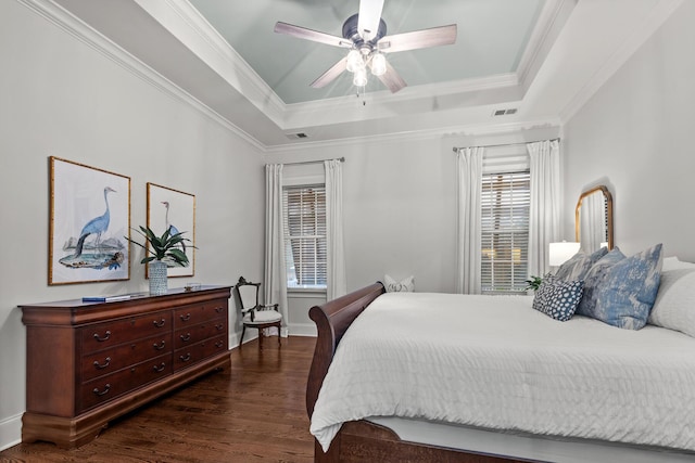2792 River Vista Way, Mount Pleasant, SC 29466 - bedroom featuring a tray ceiling, dark wood-type flooring, ornamental molding, baseboards, and a ceiling fan