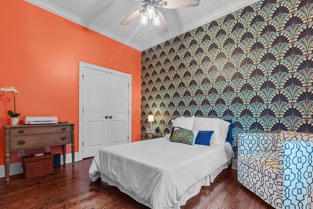 2792 River Vista Way, Mount Pleasant, SC 29466 - bedroom featuring ornamental molding, wood finished floors, ceiling fan, an accent wall, and a closet