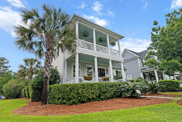 2792 River Vista Way, Mount Pleasant, SC 29466 - view of front of house featuring a balcony, a porch, and a front lawn