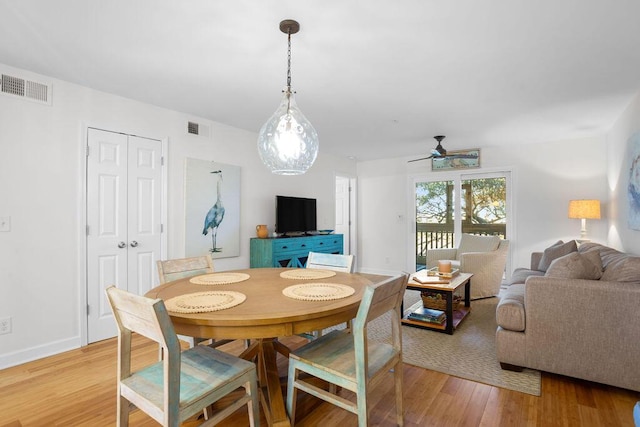 dining room featuring ceiling fan and light wood-type flooring