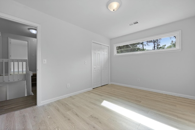 123 Lewisfield Dr, North Charleston, SC 29418 - unfurnished bedroom featuring wood finished floors, baseboards, and a closet