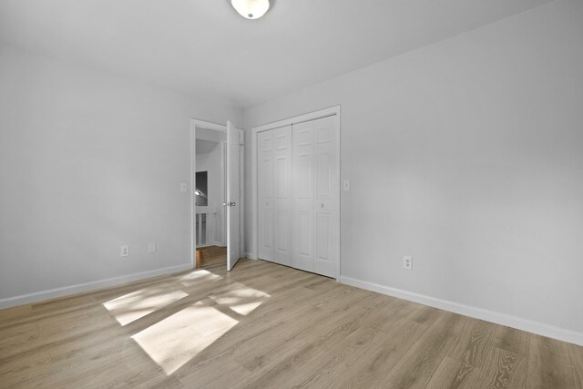 123 Lewisfield Dr, North Charleston, SC 29418 - unfurnished bedroom featuring baseboards, light wood-style floors, and a closet