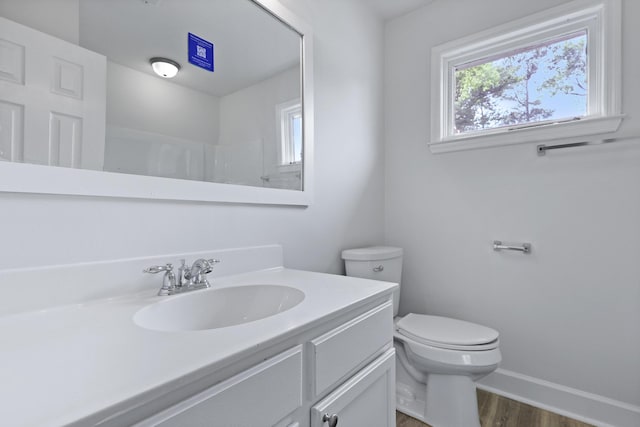 123 Lewisfield Dr, North Charleston, SC 29418 - bathroom featuring wood finished floors, toilet, vanity, and baseboards