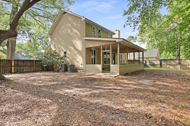 123 Lewisfield Dr, North Charleston, SC 29418 - rear view of property featuring a fenced backyard, a chimney, and cooling unit