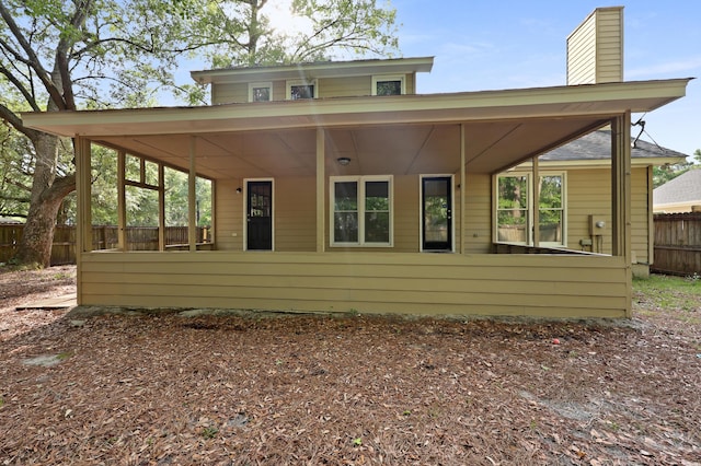 123 Lewisfield Dr, North Charleston, SC 29418 - rear view of property featuring fence and a chimney