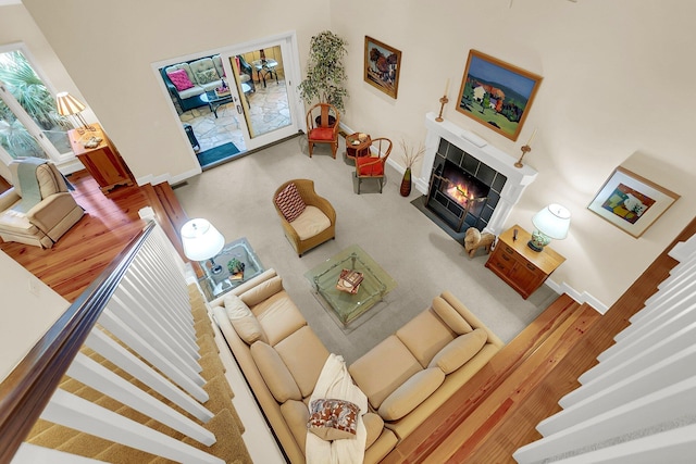 living room with a tiled fireplace