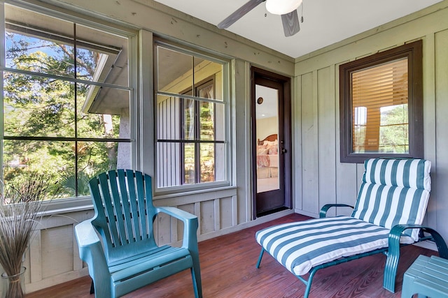 sunroom / solarium featuring ceiling fan