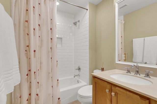 full bathroom with shower / tub combo, vanity, and toilet