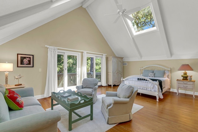 bedroom with wood-type flooring, lofted ceiling with beams, and ceiling fan