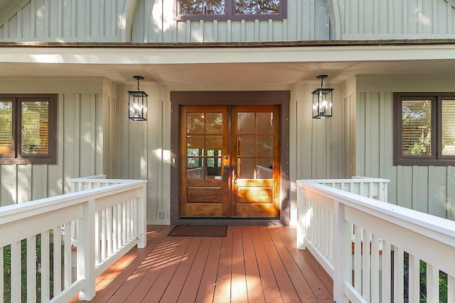 entrance to property with covered porch and french doors