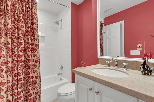 full bathroom with vanity, toilet, and shower / tub combo