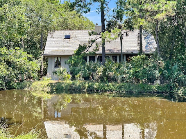 rear view of house with a water view