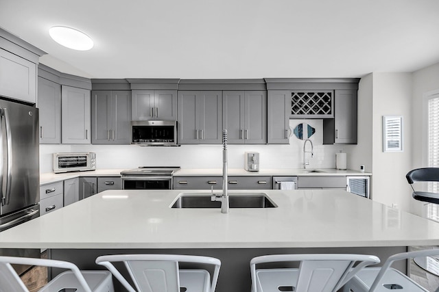 1948 Marsh Oak Ln, Seabrook Island, SC 29455 - kitchen featuring appliances with stainless steel finishes, gray cabinets, and a sink