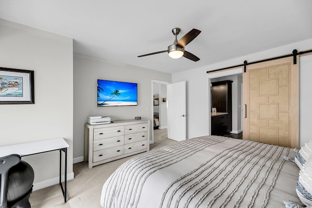 1948 Marsh Oak Ln, Seabrook Island, SC 29455 - bedroom featuring a barn door, light carpet, baseboards, a ceiling fan, and an office area