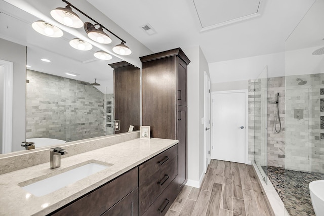 1948 Marsh Oak Ln, Seabrook Island, SC 29455 - full bath featuring a shower stall, vanity, a freestanding bath, and wood finished floors