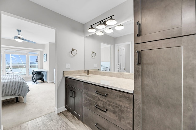 1948 Marsh Oak Ln, Seabrook Island, SC 29455 - ensuite bathroom with vanity, baseboards, ceiling fan, and wood finished floors