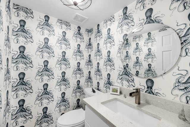 1948 Marsh Oak Ln, Seabrook Island, SC 29455 - half bath with vanity, toilet, and wallpapered walls