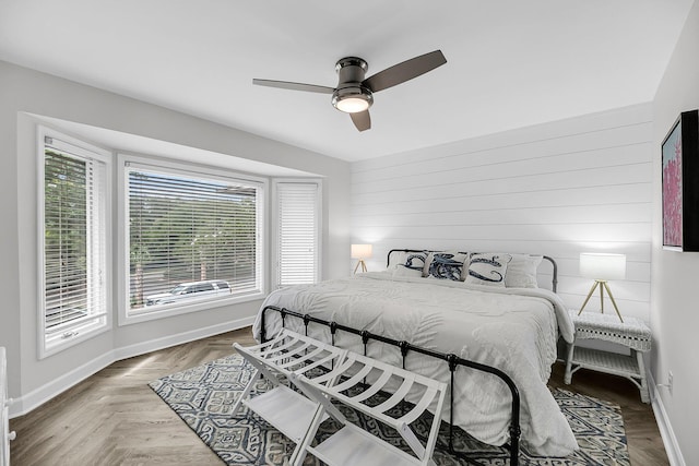 1948 Marsh Oak Ln, Seabrook Island, SC 29455 - bedroom featuring baseboards, wood walls, and ceiling fan