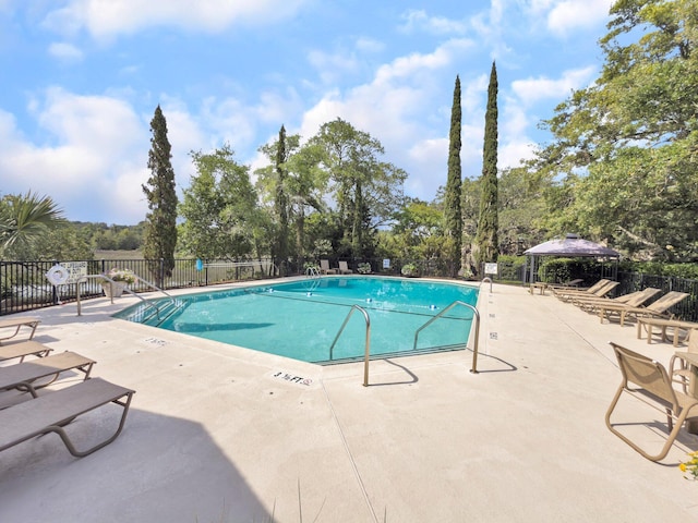 1948 Marsh Oak Ln, Seabrook Island, SC 29455 - community pool featuring a gazebo, a patio area, and view of wooded area