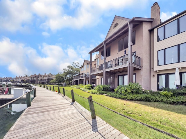 1948 Marsh Oak Ln, Seabrook Island, SC 29455 - dock featuring a lawn and a residential view