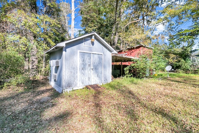 view of outbuilding featuring cooling unit