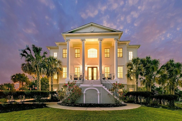 1720 Bowline Dr, Mount Pleasant, SC 29466 - neoclassical / greek revival house featuring stairs, french doors, a front yard, and covered porch