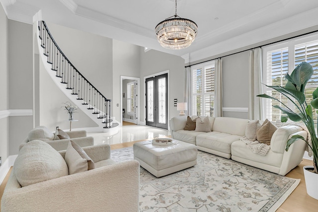 1720 Bowline Dr, Mount Pleasant, SC 29466 - living room with a chandelier, ornamental molding, stairs, wood finished floors, and baseboards