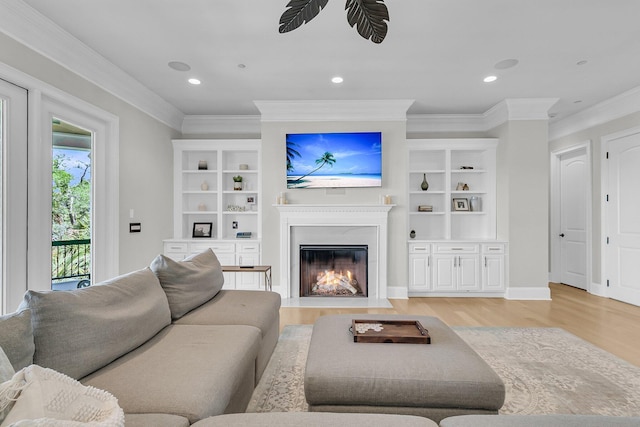 1720 Bowline Dr, Mount Pleasant, SC 29466 - living room featuring light wood finished floors, ornamental molding, a fireplace with flush hearth, recessed lighting, and a ceiling fan