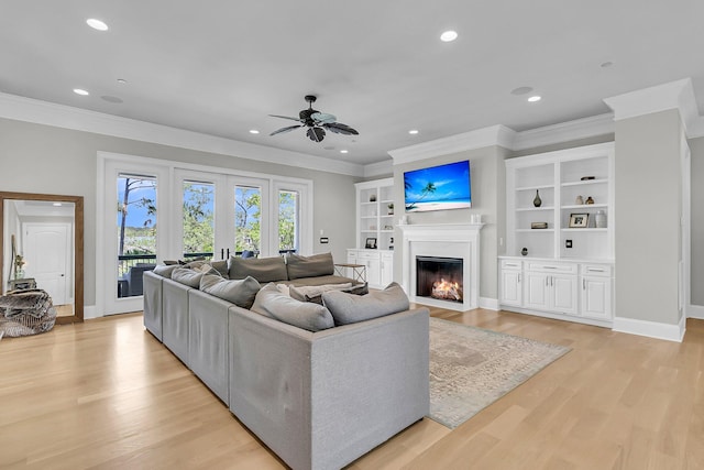 1720 Bowline Dr, Mount Pleasant, SC 29466 - living area featuring a fireplace with flush hearth, a ceiling fan, ornamental molding, light wood finished floors, and recessed lighting